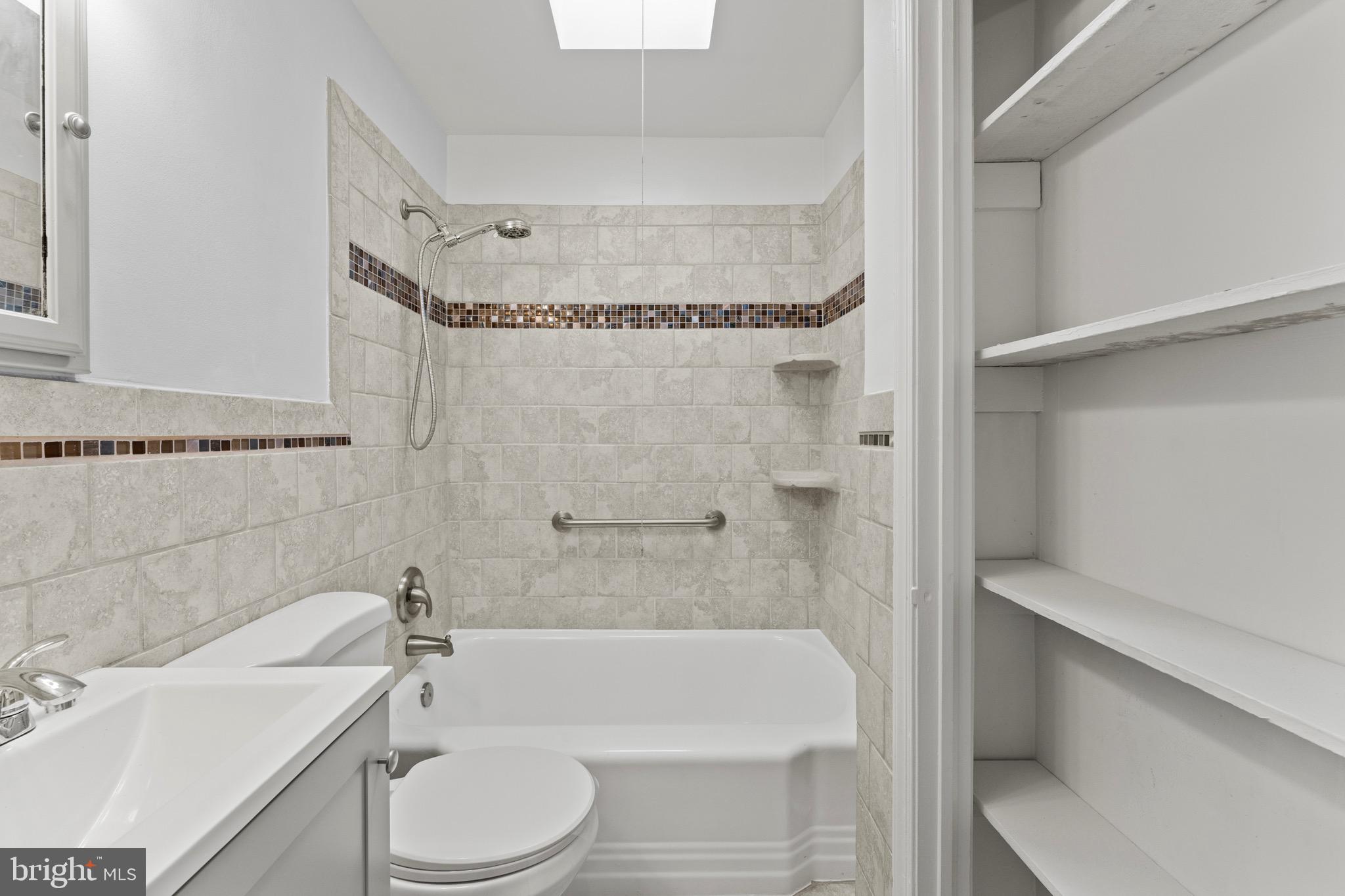 3693 Kenyon Avenue Baltimore, MD 21213 - Photo 16 of 34 a bathroom with a toilet and a bathtub