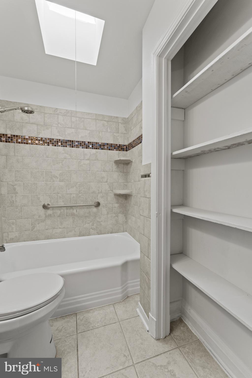 3693 Kenyon Avenue Baltimore, MD 21213 - Photo 17 of 34 a bathroom with a toilet and a bathtub