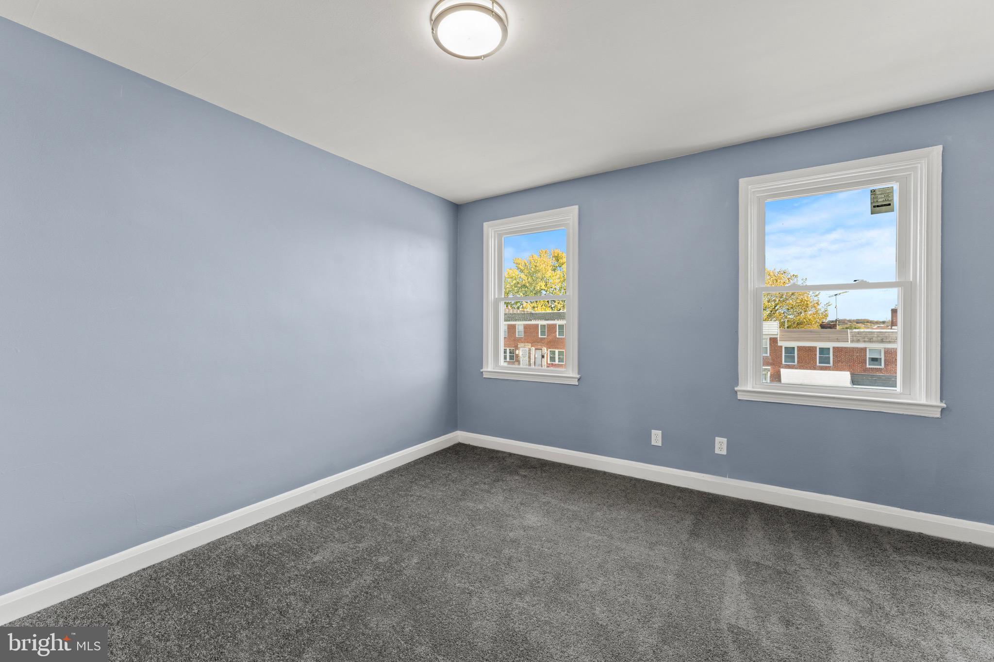 3693 Kenyon Avenue Baltimore, MD 21213 - Photo 19 of 34 an empty room with windows