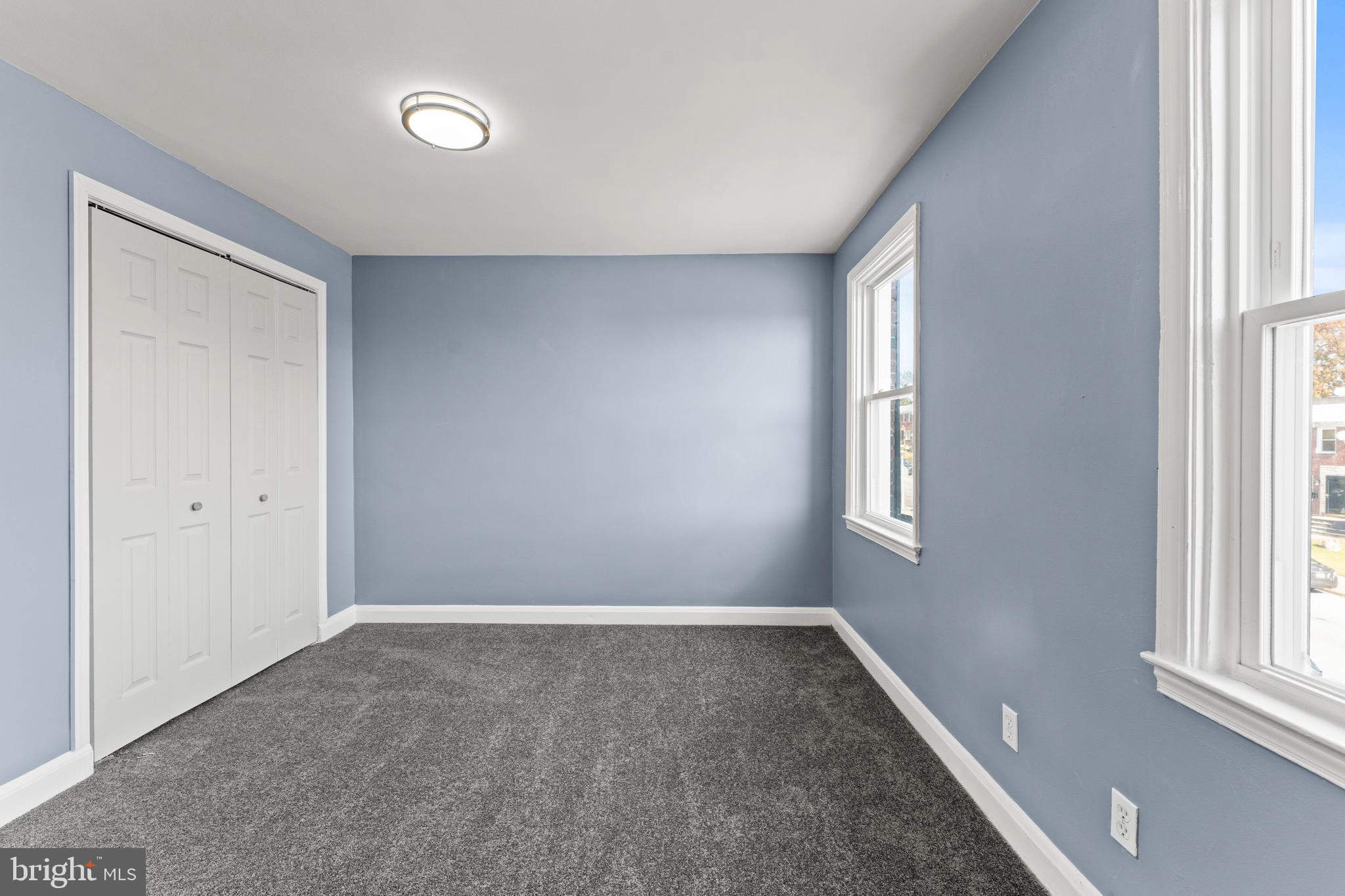 3693 Kenyon Avenue Baltimore, MD 21213 - Photo 23 of 34 an empty room with windows