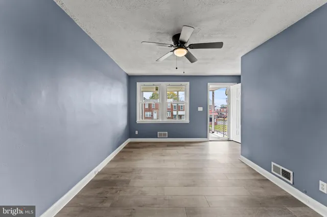 a view of an empty room with a window