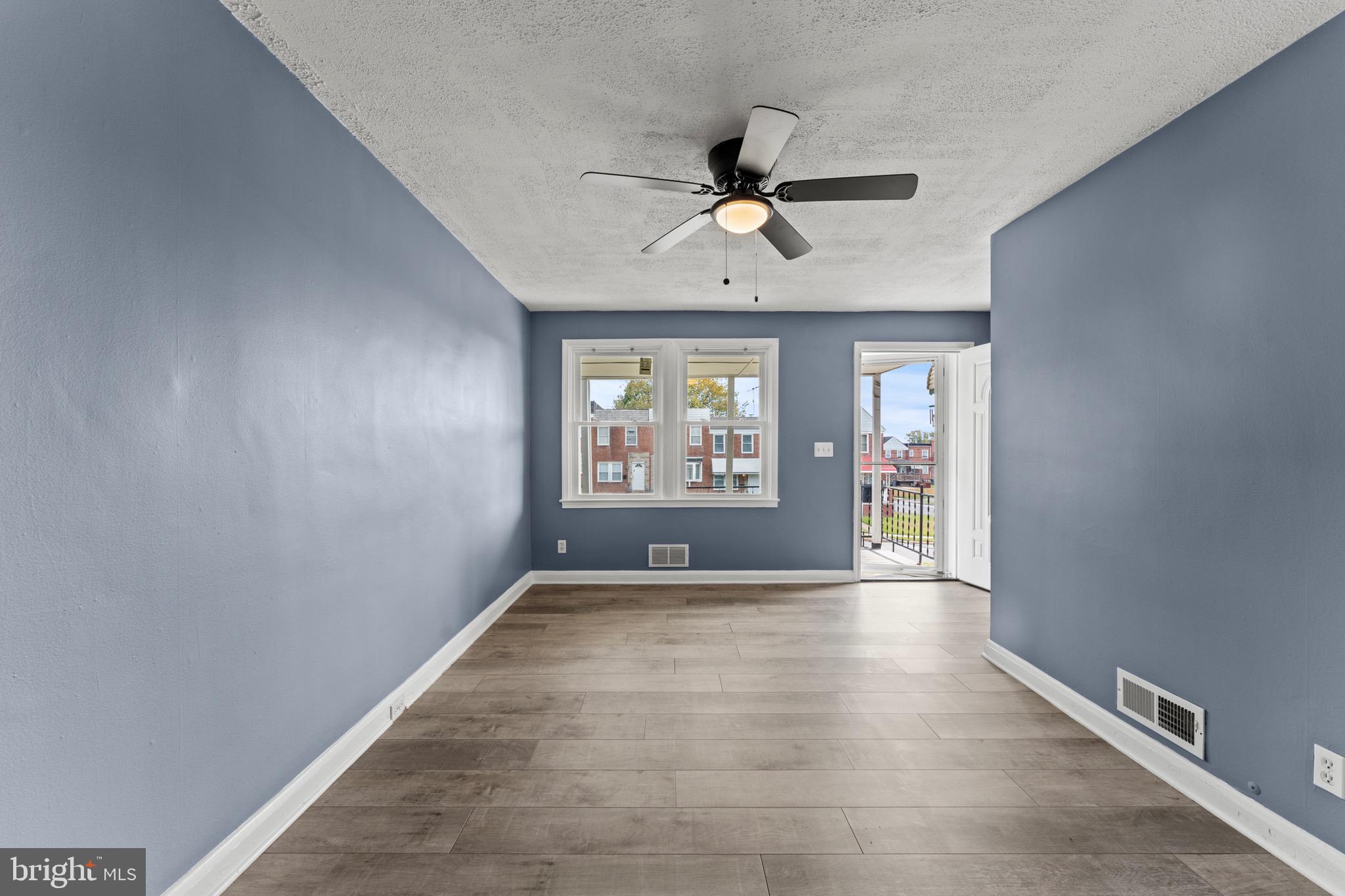 3693 Kenyon Avenue Baltimore, MD 21213 - Photo 5 of 34 a view of an empty room with a window