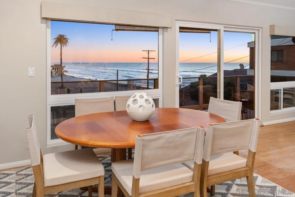a view of a dining room with furniture and window