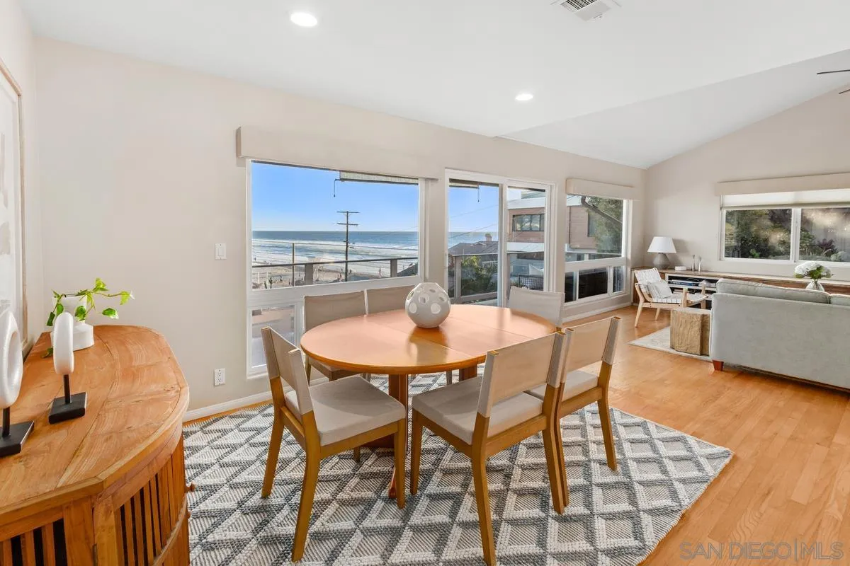 231 5th Street Encinitas, CA 92024 - Photo 18 of 43 a dining room with furniture and chandelier