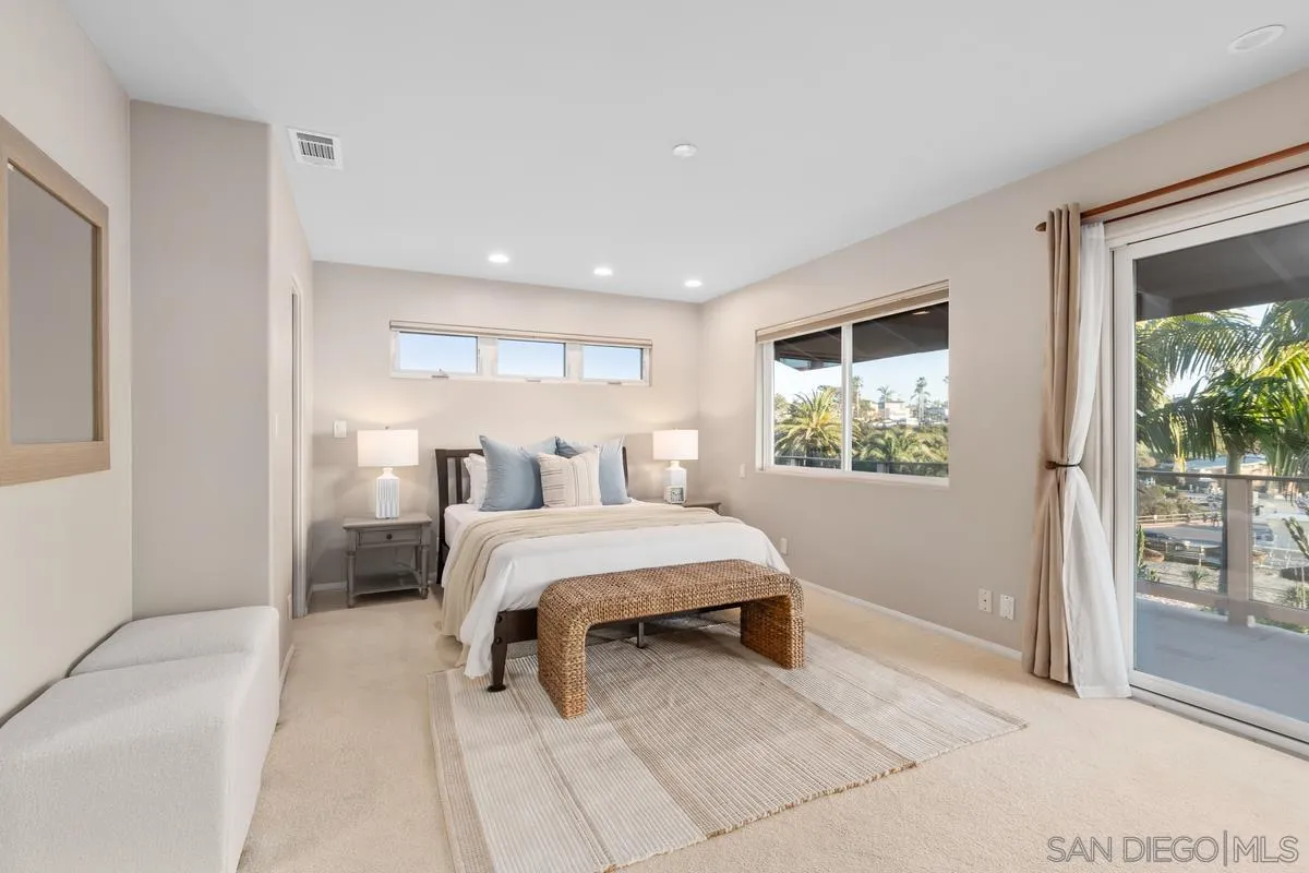 231 5th Street Encinitas, CA 92024 - Photo 22 of 43 a bedroom with a large bed and a window