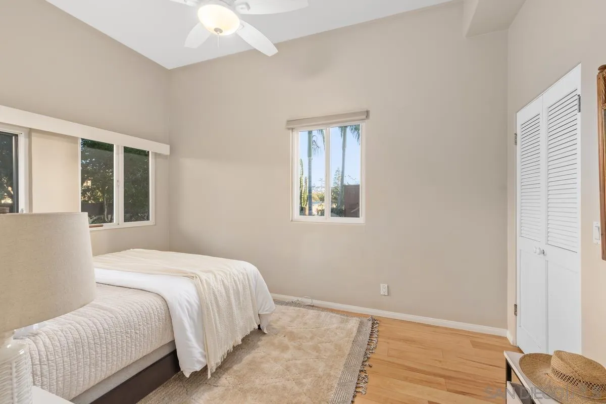 231 5th Street Encinitas, CA 92024 - Photo 27 of 43 a bedroom with a bed and a window