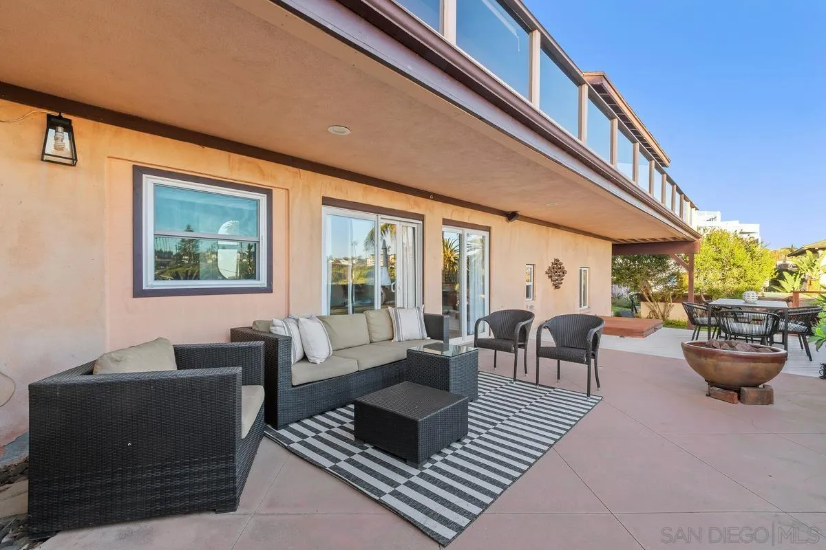 231 5th Street Encinitas, CA 92024 - Photo 5 of 43 a living room with furniture and a large window
