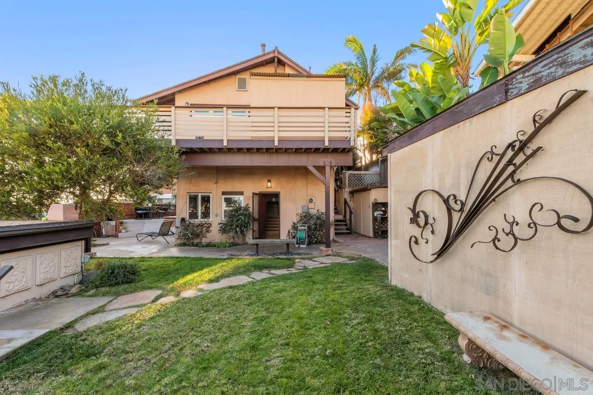 231 5th Street Encinitas, CA 92024 - Photo 9 of 43 a view of a chair and table in backyard of the house