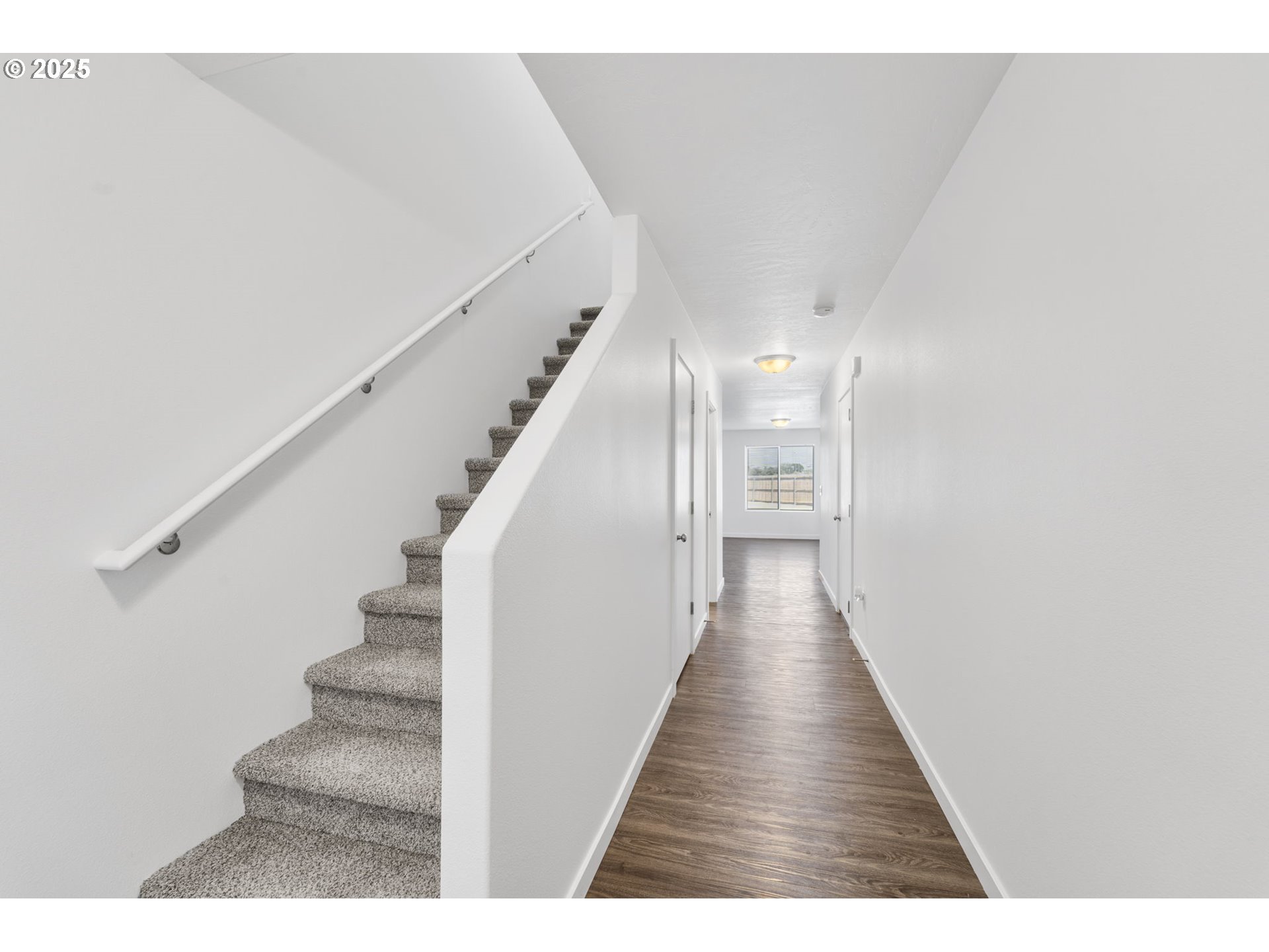 774 Northeast 11th Street Hermiston, OR 97838 - Photo 2 of 34 a view of a hallway with wooden floor