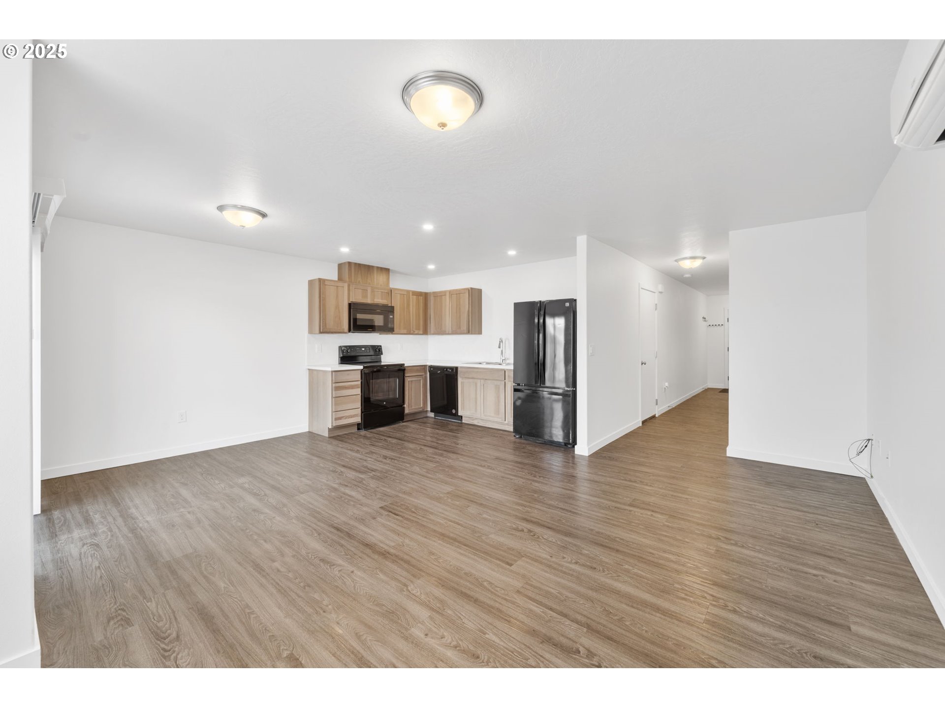 774 Northeast 11th Street Hermiston, OR 97838 - Photo 5 of 34 a view of a kitchen with a sink and a microwave