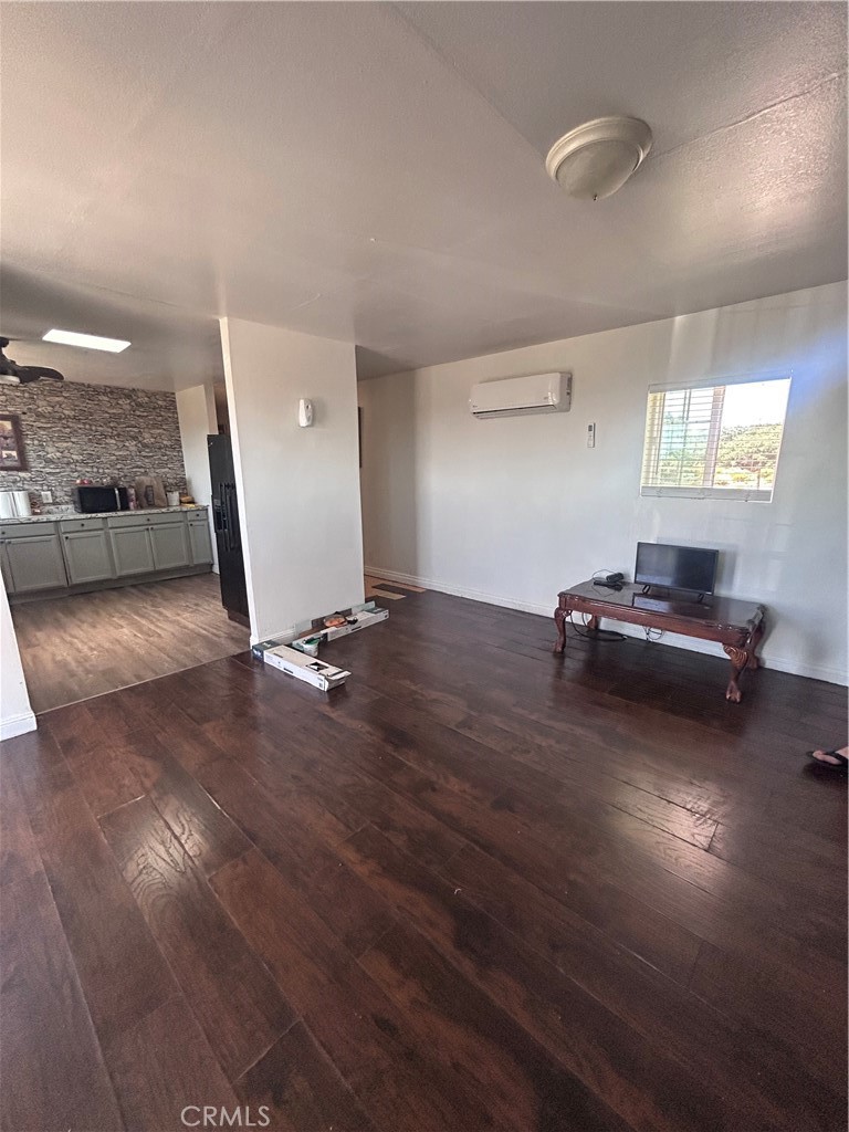 8471 Caughlin Road Phelan, CA 92371 - Photo 21 of 21 a living room with furniture and a window