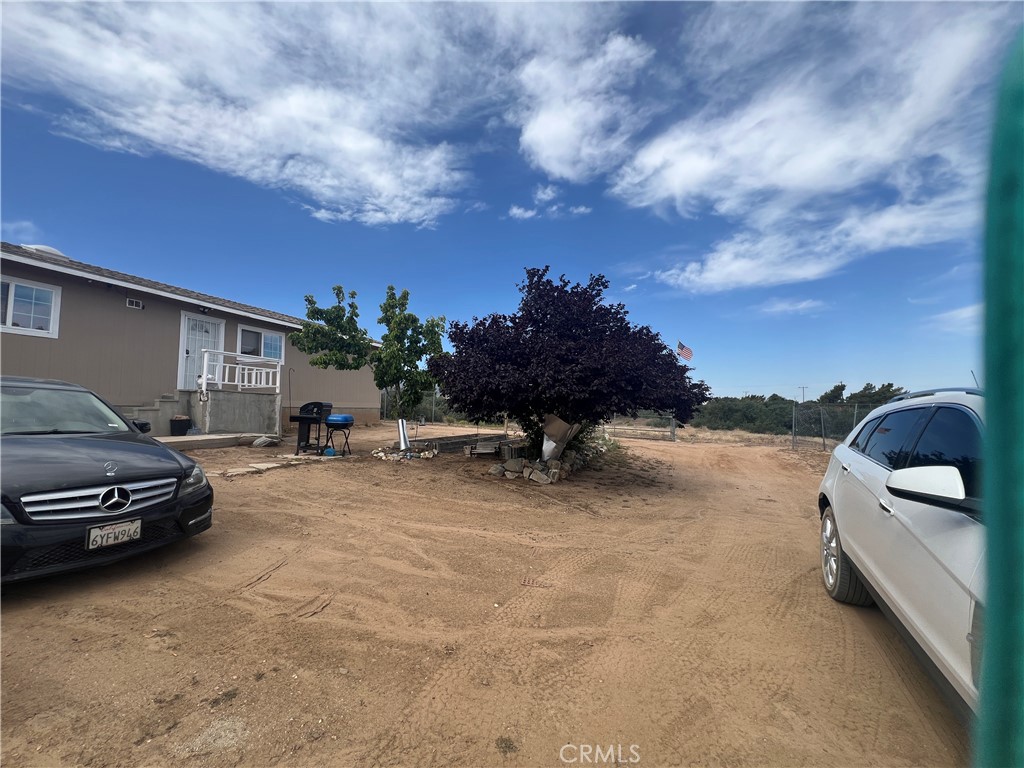 8471 Caughlin Road Phelan, CA 92371 - Photo 5 of 21 a view of a car park in front of a house
