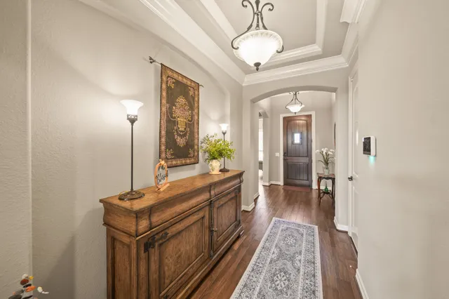 a spacious bathroom with a mirror and a sink