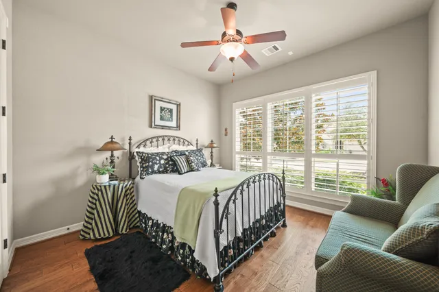 a bedroom with a bed and a couch