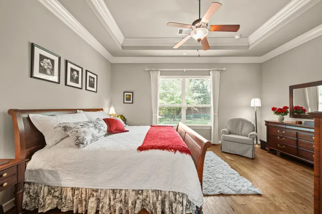 a bedroom with a large bed and a couch