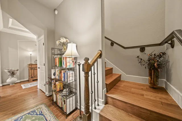 a view of entryway and hall with wooden floor