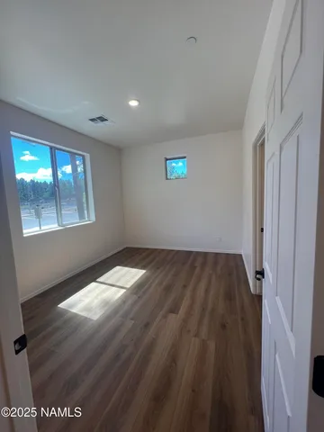 a view of a workspace with furniture