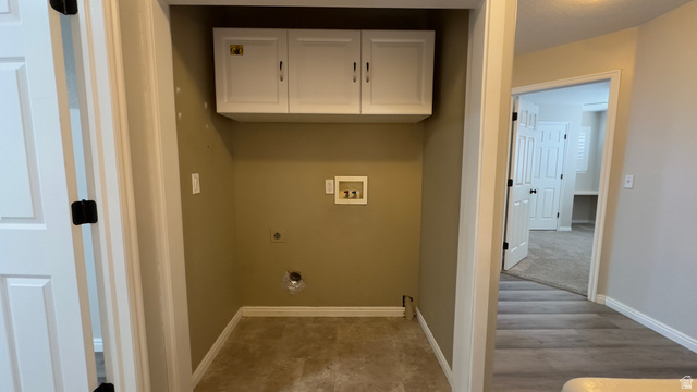 3547 East Golden Eagle Road Eagle Mountain, UT 84005 - Photo 25 of 47 Laundry room with cabinet space, hookup for a washing machine, light wood-style flooring, and hookup for an electric dryer