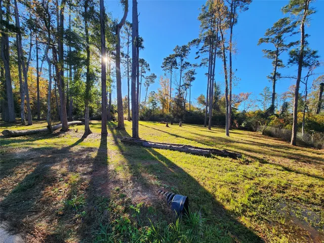 a view of a yard with swimming pool