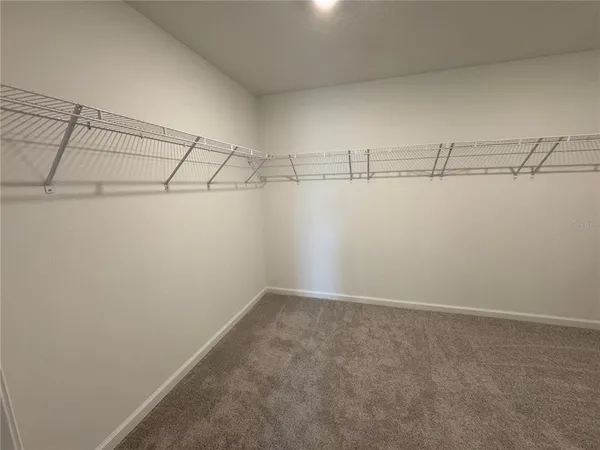 a view of a room with racks on the wall