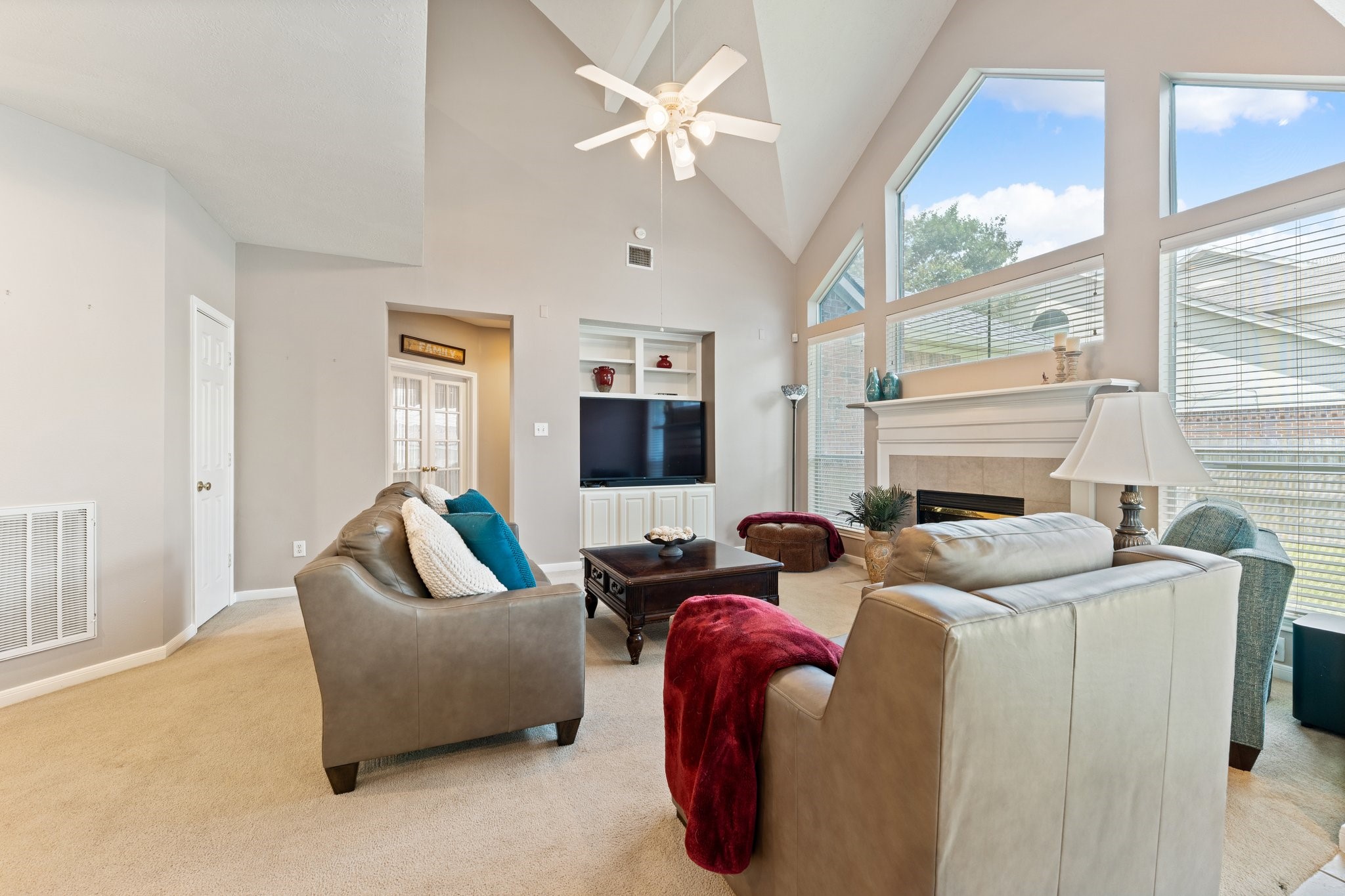 25447 China Springs Spring, TX 77373 - Photo 17 of 45 A bright family room with high ceilings where the impressive windows become the focal point of the home, while the built ins offer additional storage.