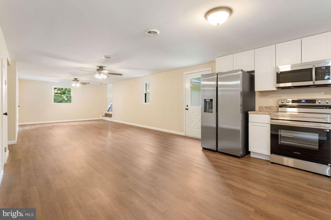 2325 York Road Gettysburg, PA 17325 - Photo 28 of 63 a view of a kitchen with a stove cabinets and wooden floor
