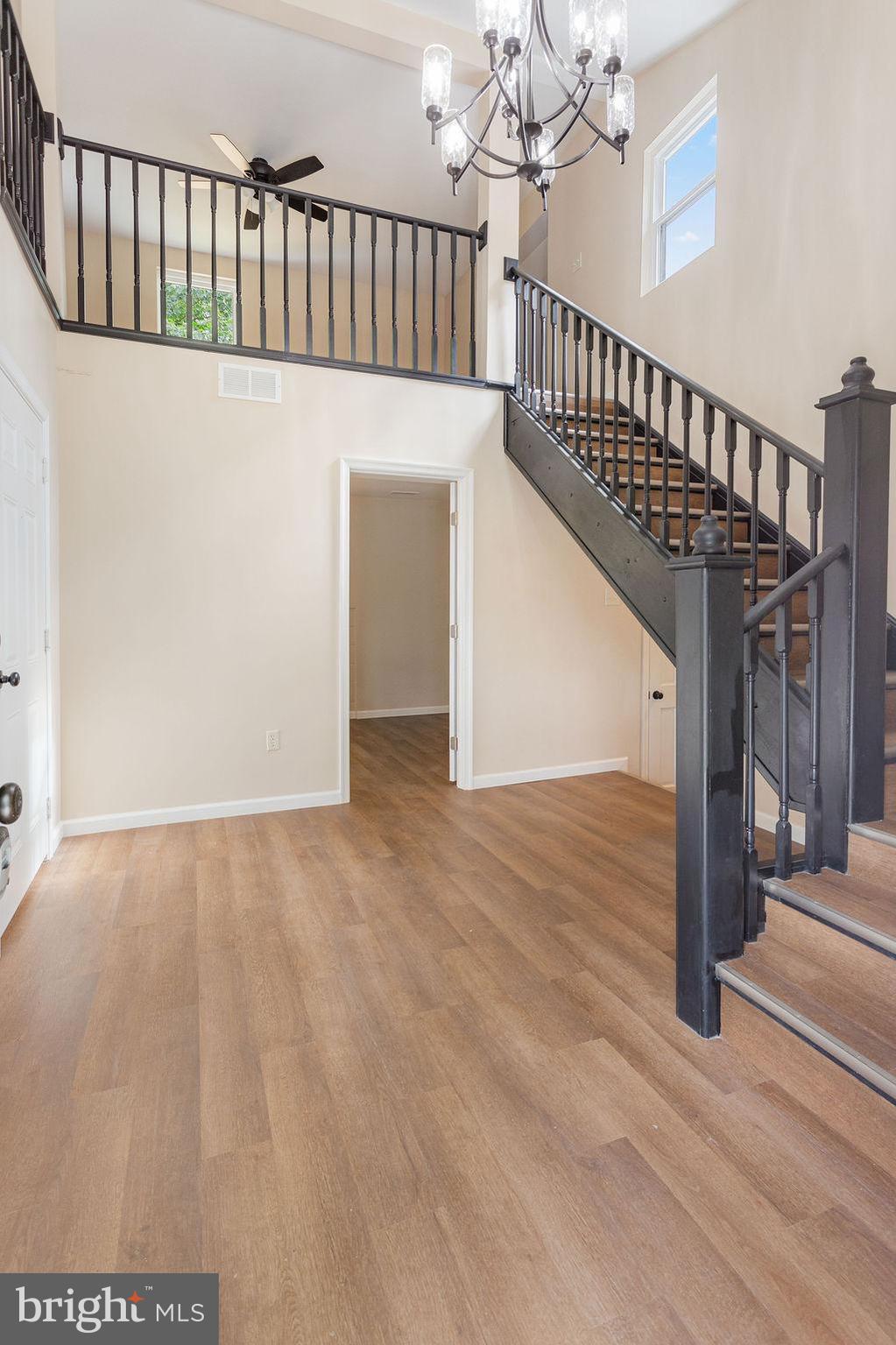 2325 York Road Gettysburg, PA 17325 - Photo 5 of 63 a view of staircase with railing and a chandelier