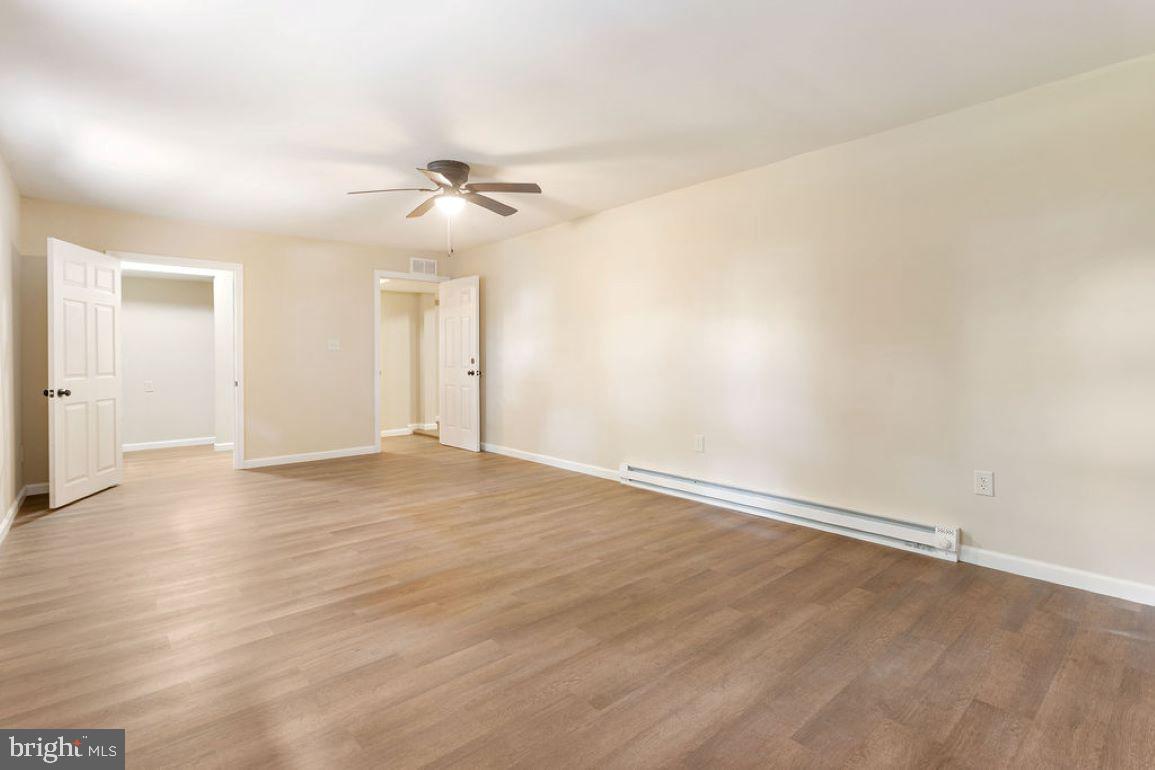 2325 York Road Gettysburg, PA 17325 - Photo 10 of 63 an empty room with wooden floor ceiling fan and window