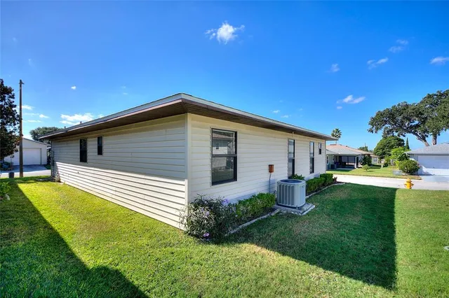 a front view of house with yard and outdoor seating