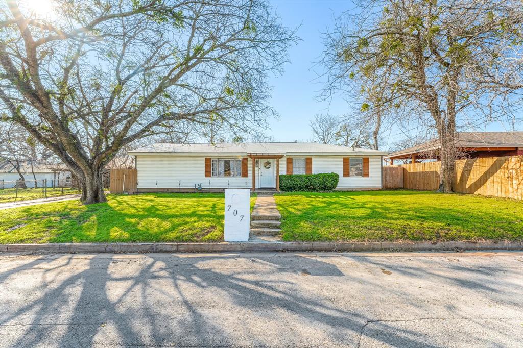 707 North Walnut Street Weatherford, TX 76086 - Photo 1 of 1 a front view of a house with garden