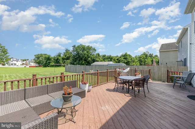 a view of a patio with a table and chairs