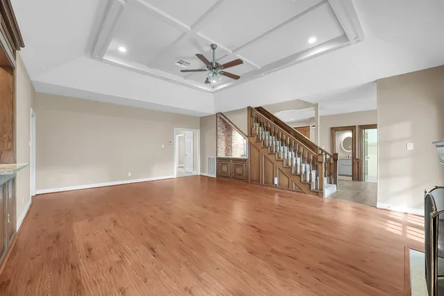 a kitchen with granite countertop a stove and a microwave