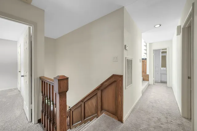 a view of a big room with closet and windows