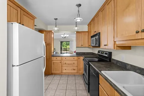 a kitchen with a refrigerator a sink and dishwasher