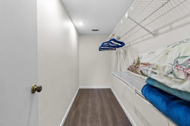 a view of a hallway with a white walls