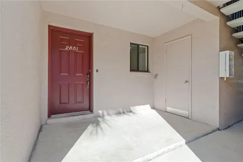 a bedroom with a bed and a closet