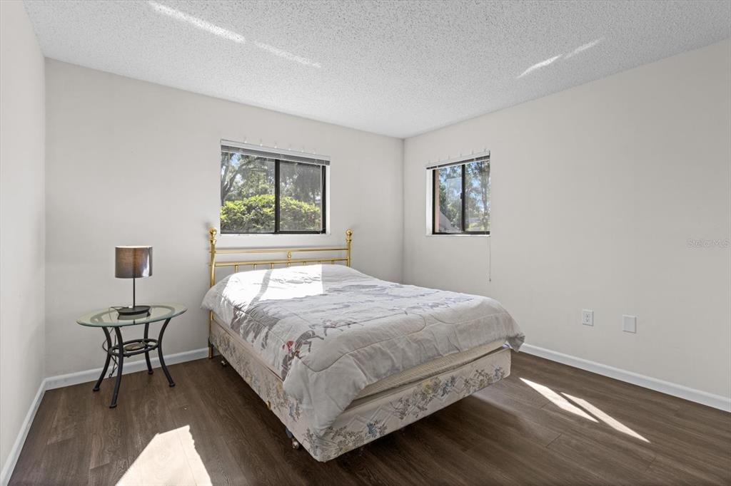 2851 Southwest 32nd Avenue, Unit B6 Ocala, FL 34474 - Photo 21 of 31 a bedroom with a bed and a chair