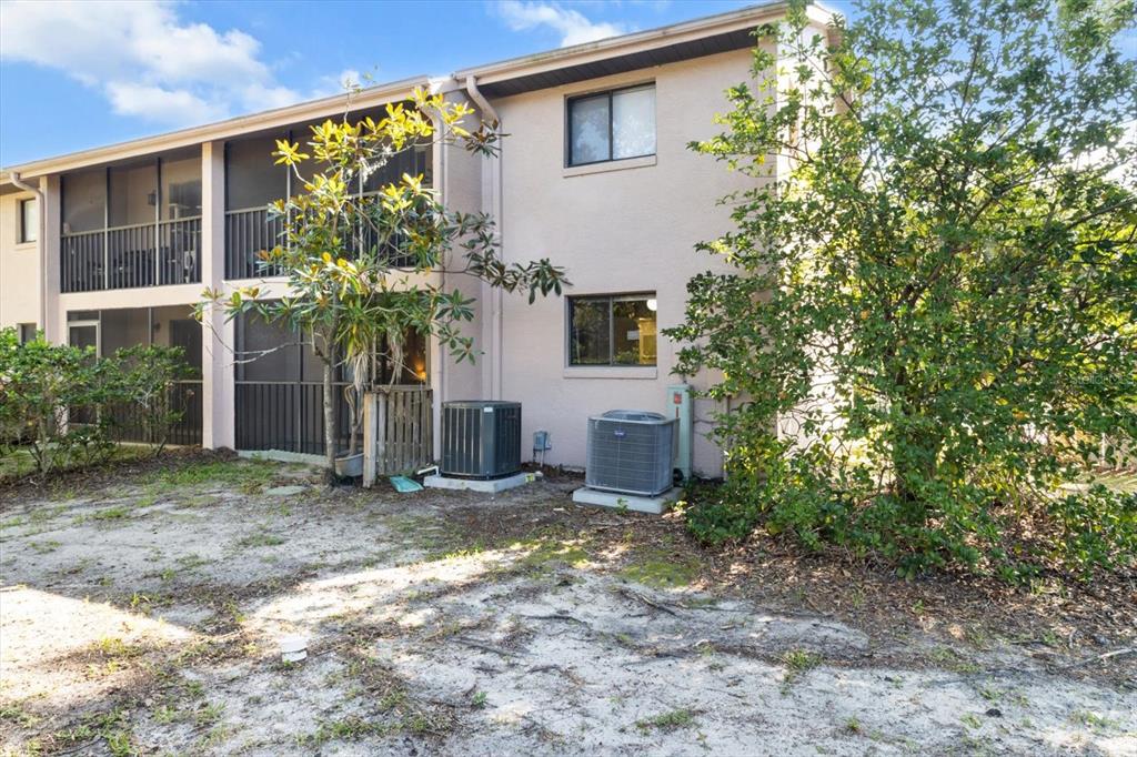 2851 Southwest 32nd Avenue, Unit B6 Ocala, FL 34474 - Photo 29 of 31 a view of a house with a yard and potted plants