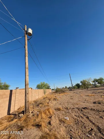 a view of a road with an house in the background