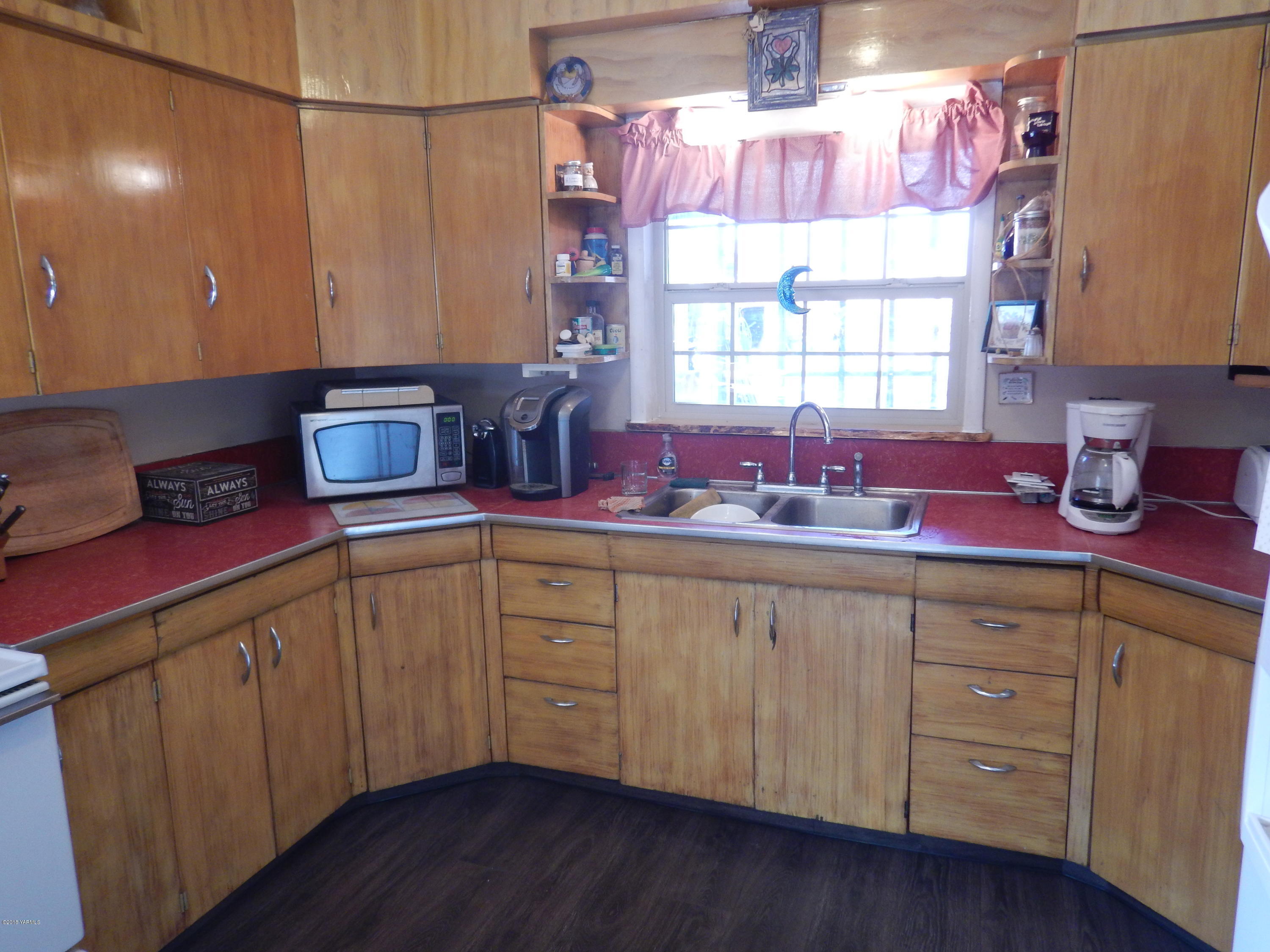 21 Klockhamer Road Naches, WA 98937 - Photo 22 of 34 a kitchen with sink cabinets and window