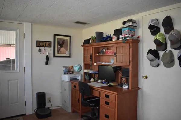 a bedroom with a bed and furniture