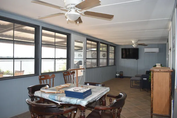 a view of a livingroom with furniture and windows