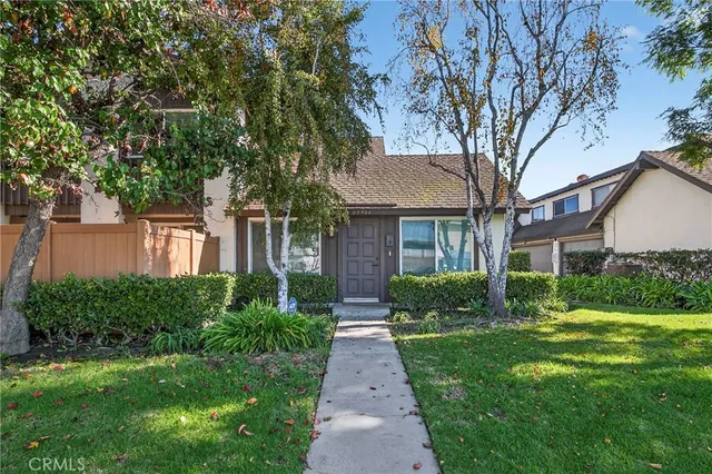 a view of a house with a yard and garage