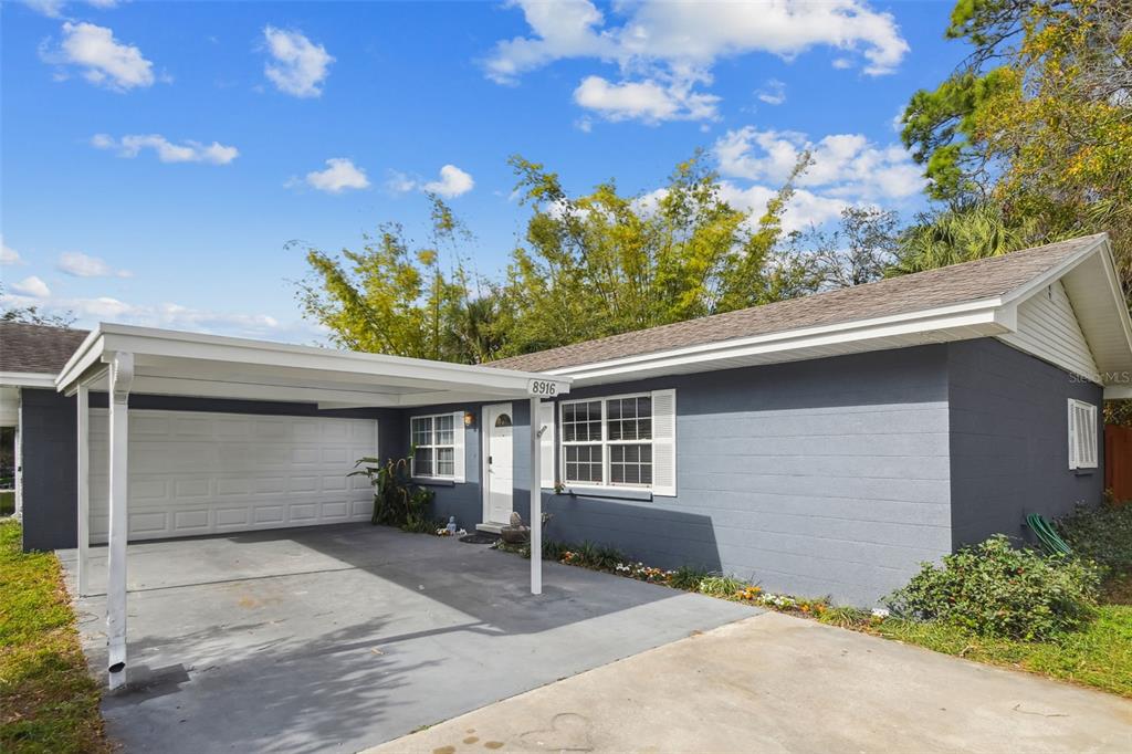8916 Memorial Highway Tampa, FL 33615 - Photo 1 of 1 Huge driveway with carport and 2 car garage