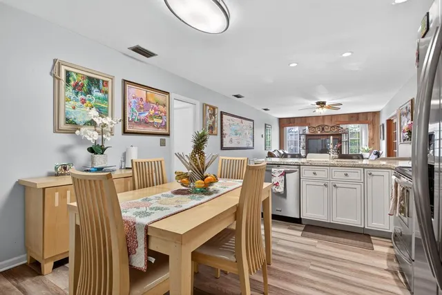 a kitchen with stainless steel appliances granite countertop a stove sink and cabinets