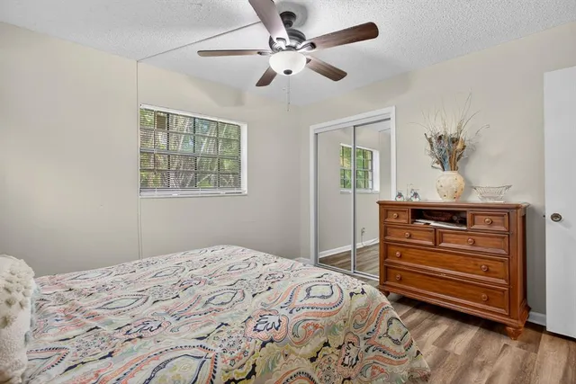 a view of a kitchen with furniture and a ceiling fan