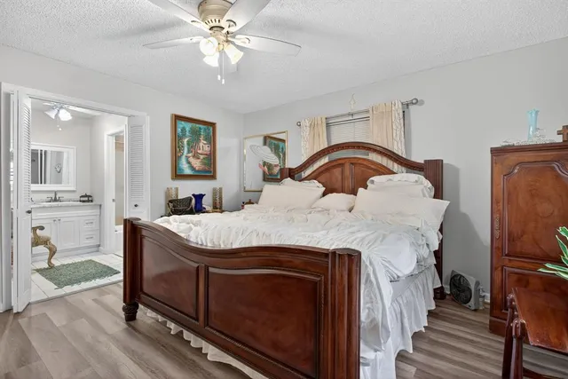 a view of walk in closet with clothes
