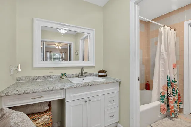 a view of a hallway with wooden floor and closet