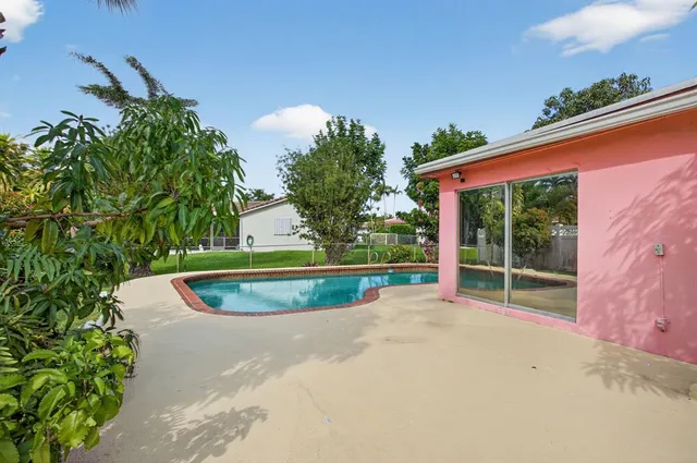 a view of a swimming pool with a patio