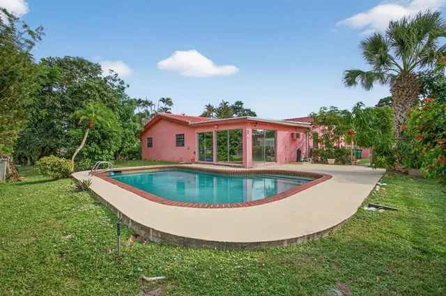 a view of a swimming pool with a porch